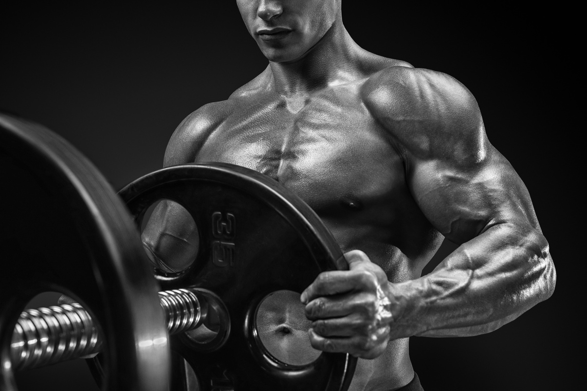 Bodybuilder prepare to do exercises with barbell